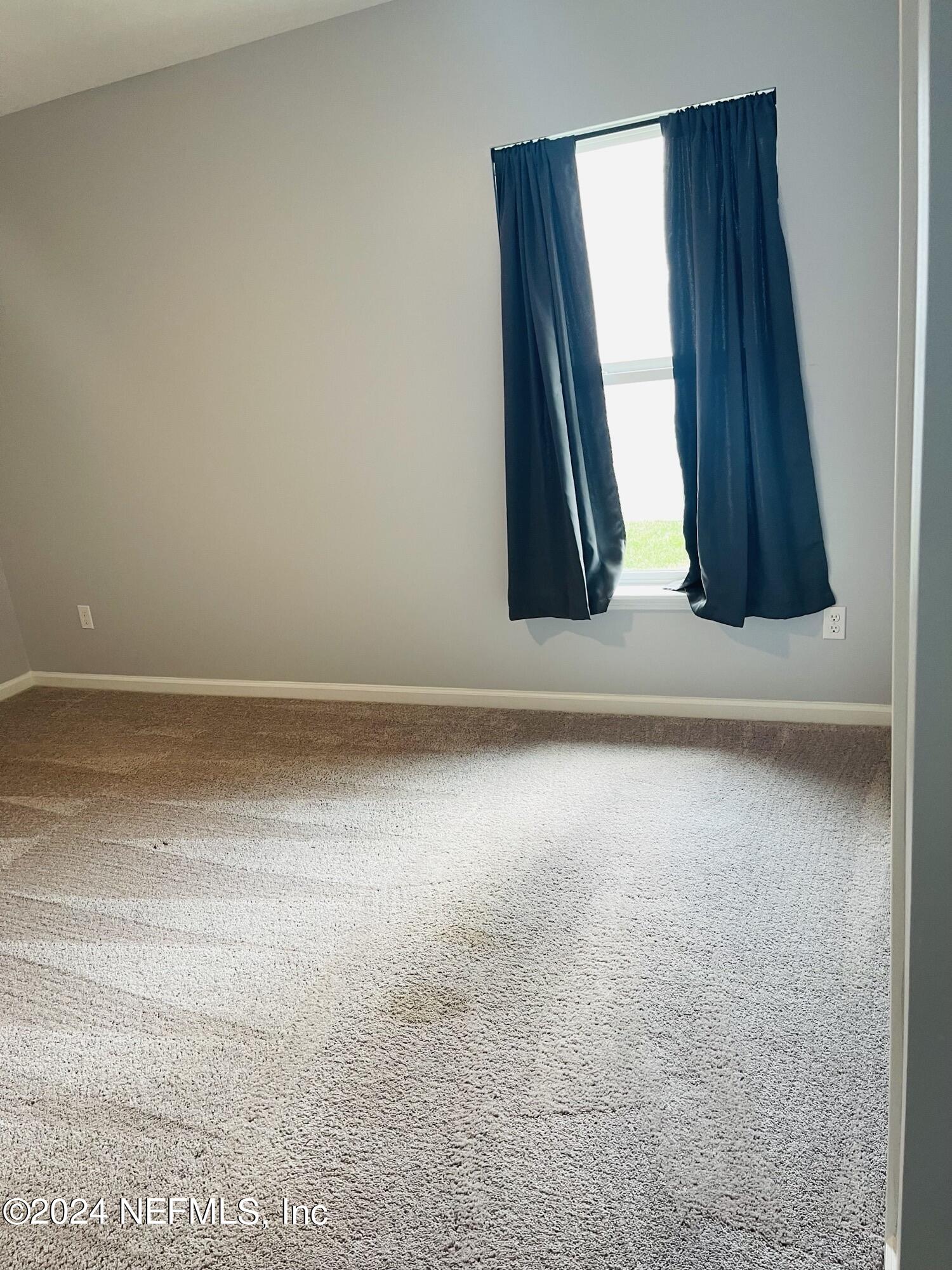 86508 Secluded Place Yulee, FL 32097 - Photo 34 of 43 an empty room with a window