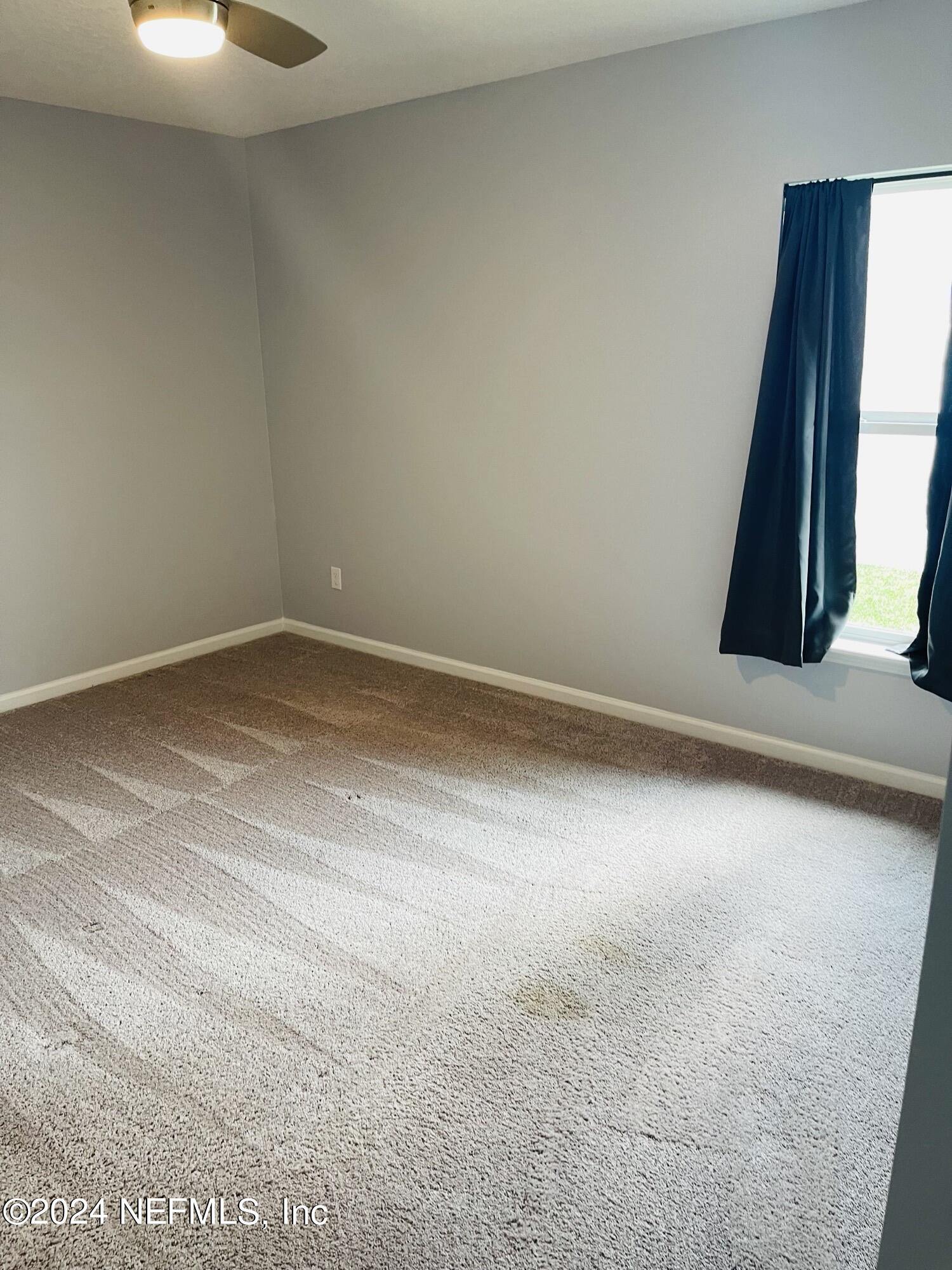 86508 Secluded Place Yulee, FL 32097 - Photo 35 of 43 a view of an empty room with a window