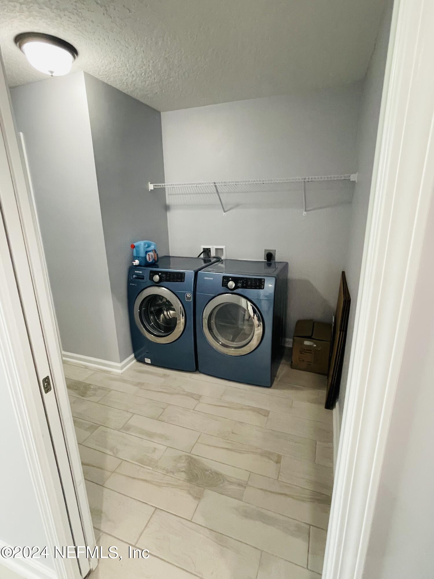 86508 Secluded Place Yulee, FL 32097 - Photo 39 of 43 a utility room with dryer and washer