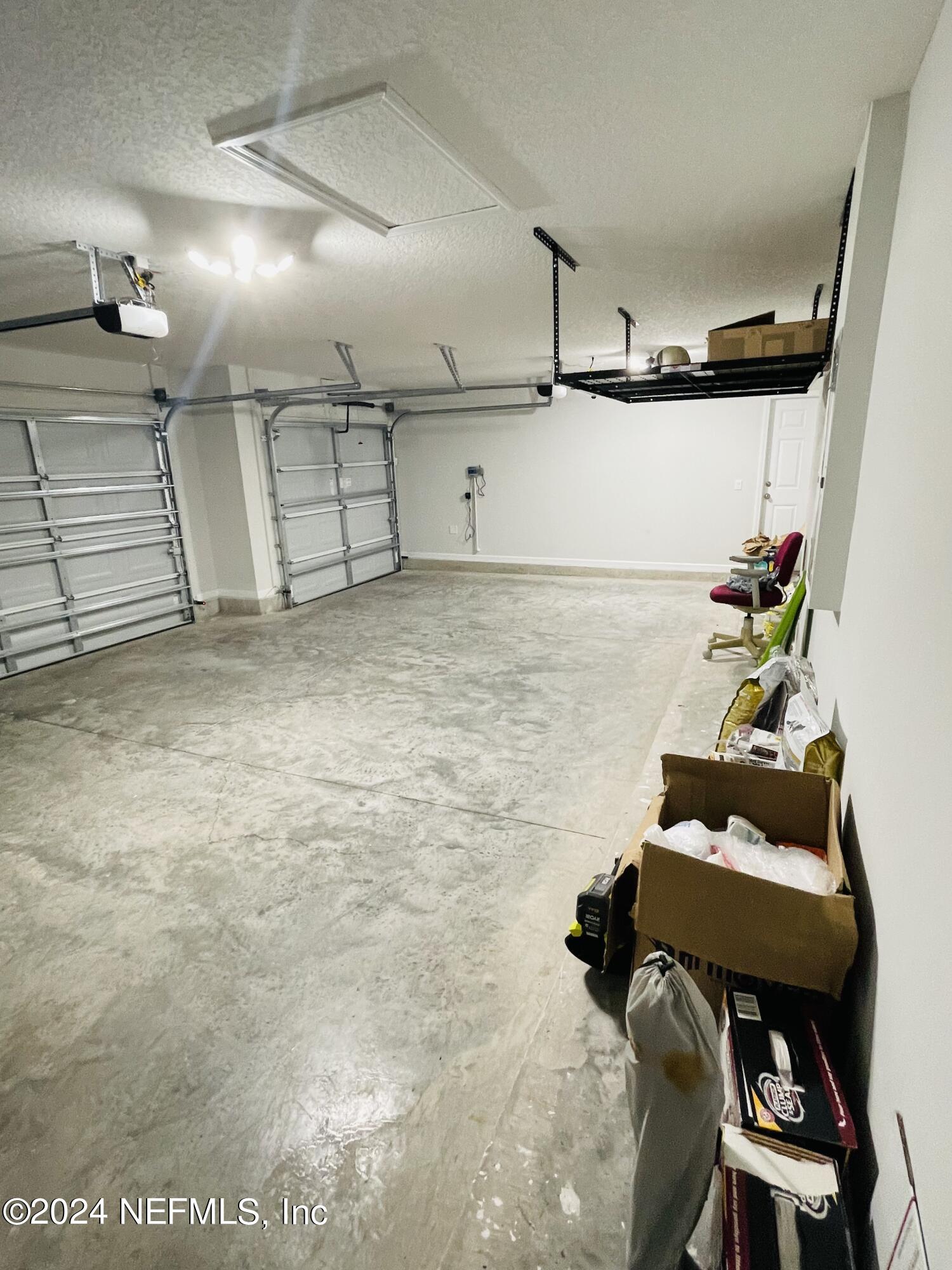 86508 Secluded Place Yulee, FL 32097 - Photo 43 of 43 a hallway with table and chairs