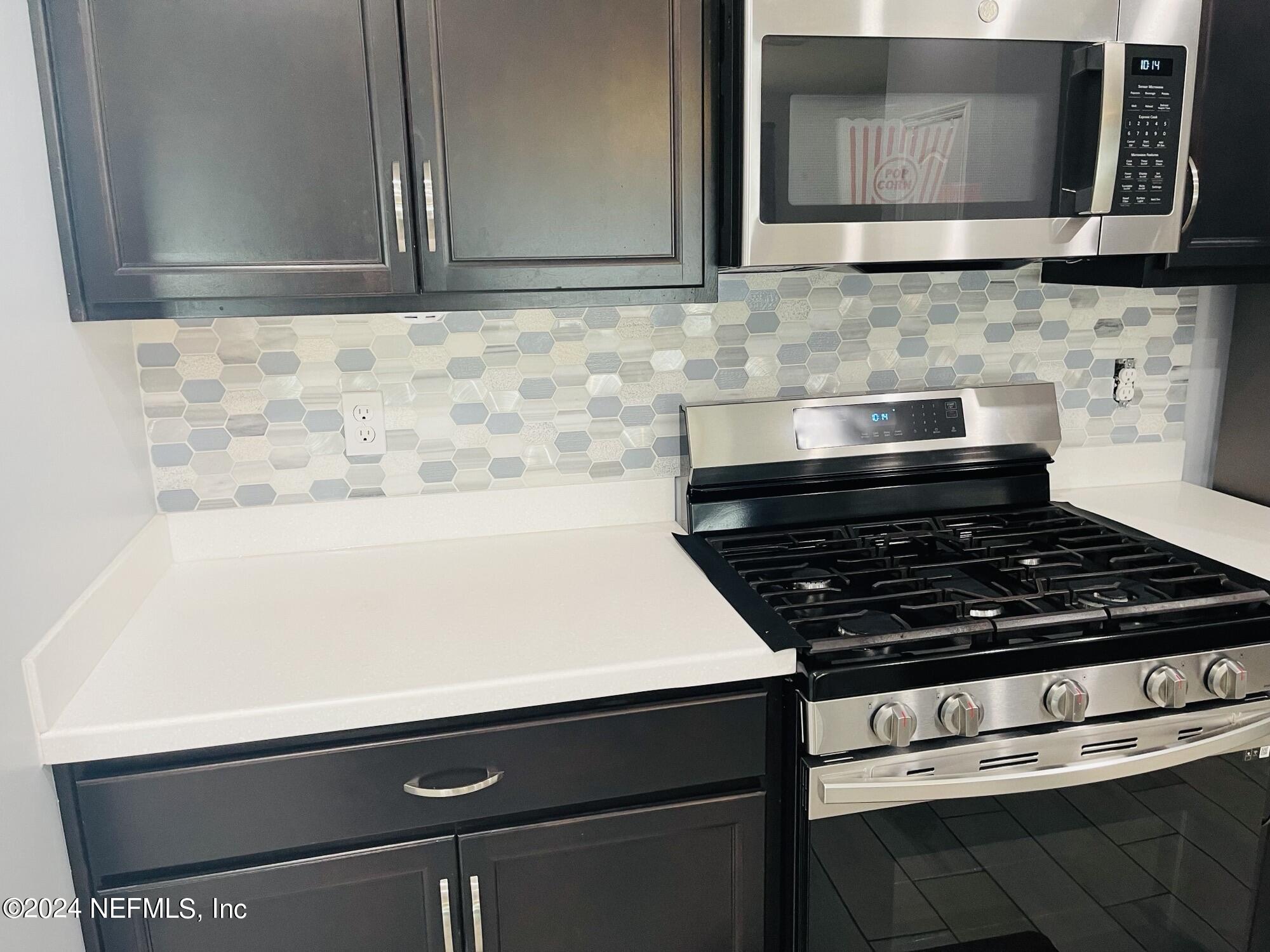 86508 Secluded Place Yulee, FL 32097 - Photo 9 of 43 a stove top oven sitting inside of a kitchen