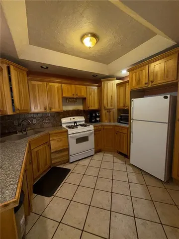 a living room with a fireplace and a flat screen tv