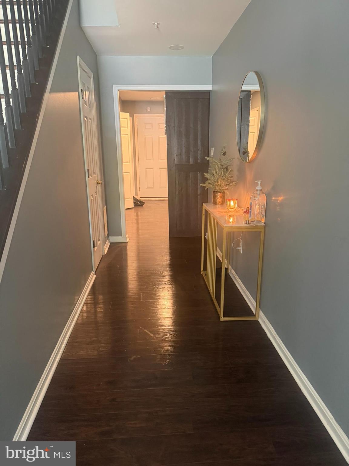 2251 Commissary Circle Odenton, MD 21113 - Photo 15 of 17 a view of a hallway with wooden floor and staircase