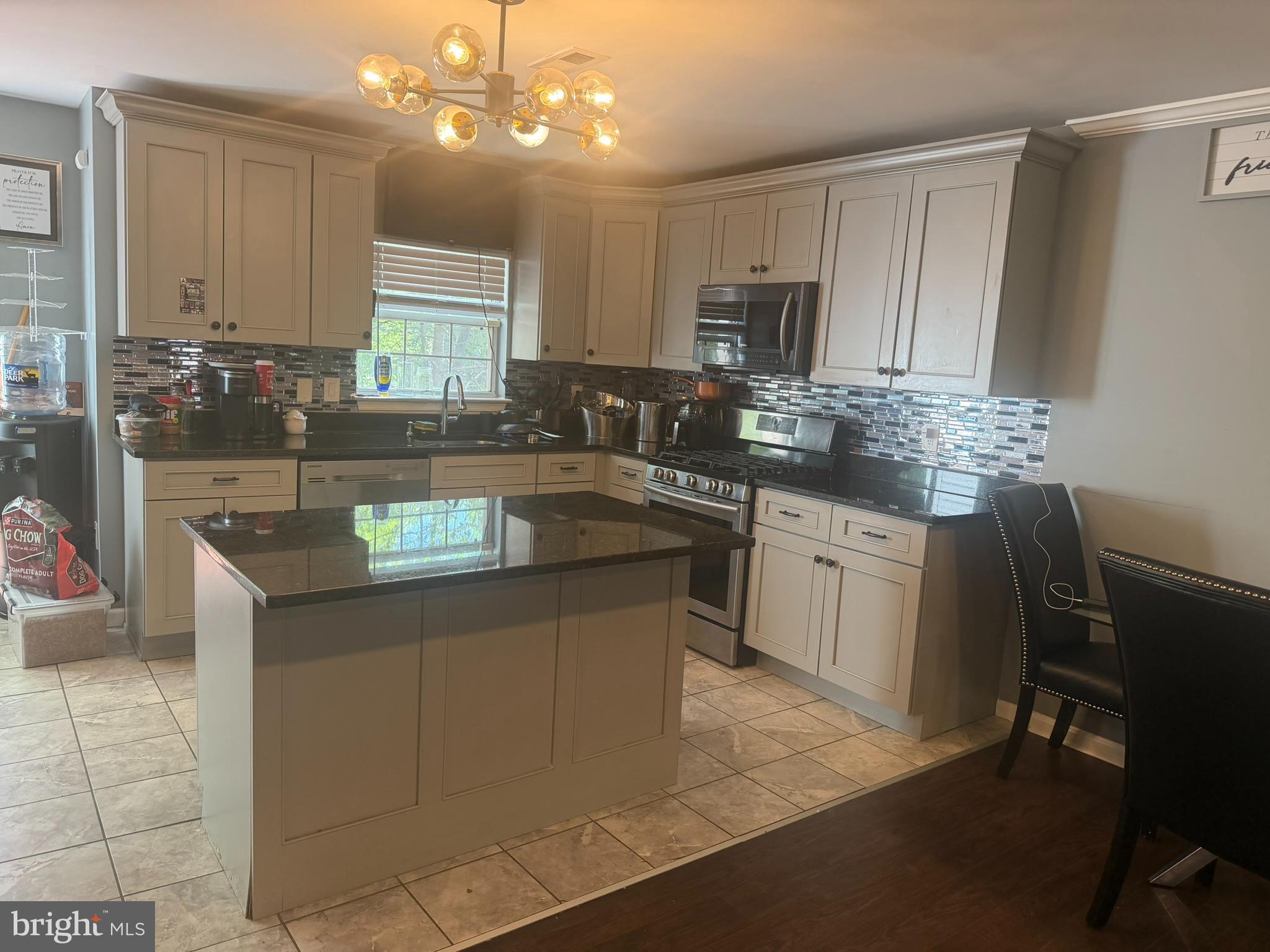 2251 Commissary Circle Odenton, MD 21113 - Photo 2 of 17 a kitchen with a sink stove and cabinets