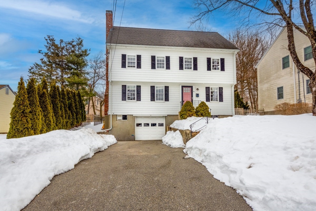 63 Dexter Road Lexington, MA 02420 - Photo 1 of 19 a front view of a house with a outdoor space