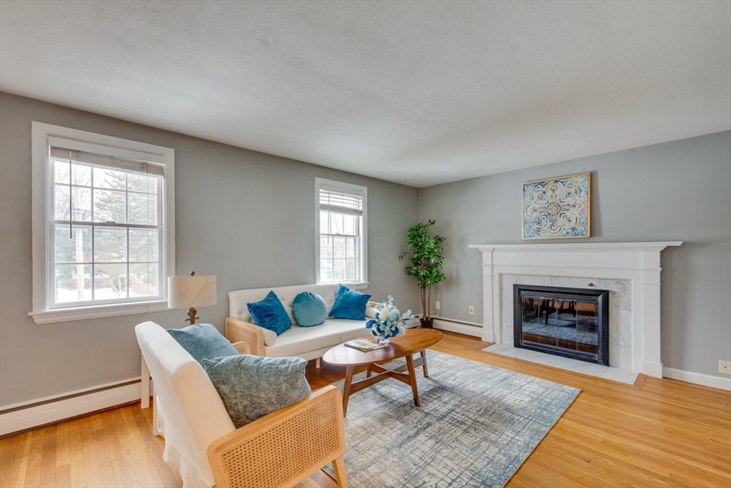 63 Dexter Road Lexington, MA 02420 - Photo 2 of 19 a living room with furniture and a fireplace