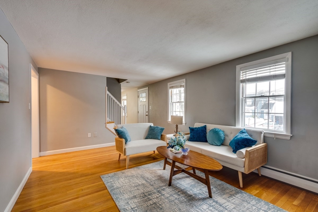 63 Dexter Road Lexington, MA 02420 - Photo 3 of 19 a living room with furniture and a rug