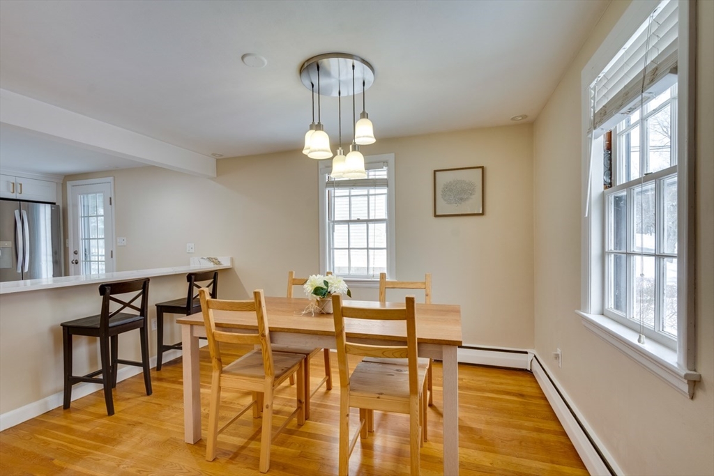 63 Dexter Road Lexington, MA 02420 - Photo 4 of 19 a view of a dining room with furniture and wooden floor