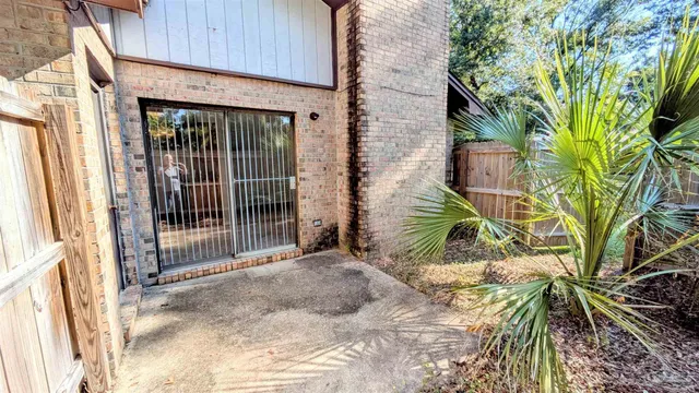 a view of a house with a tree