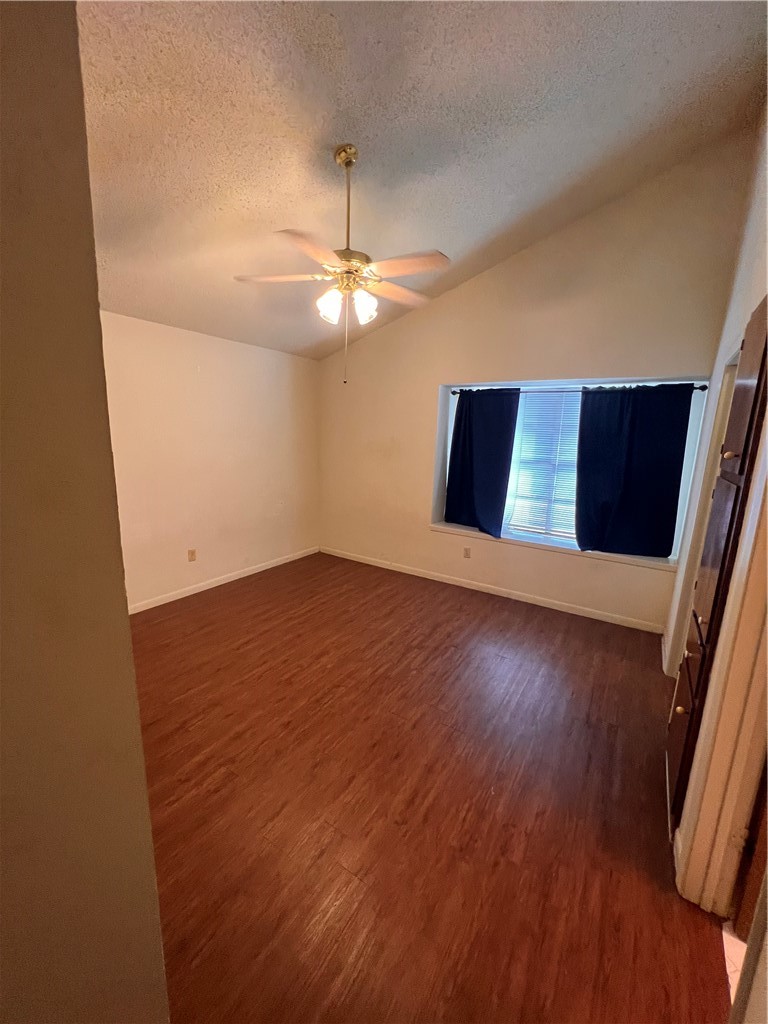 4021 Acushnet Drive, Unit F Corpus Christi, TX 78413 - Photo 13 of 21 en empty room with wooden floor and chandelier
