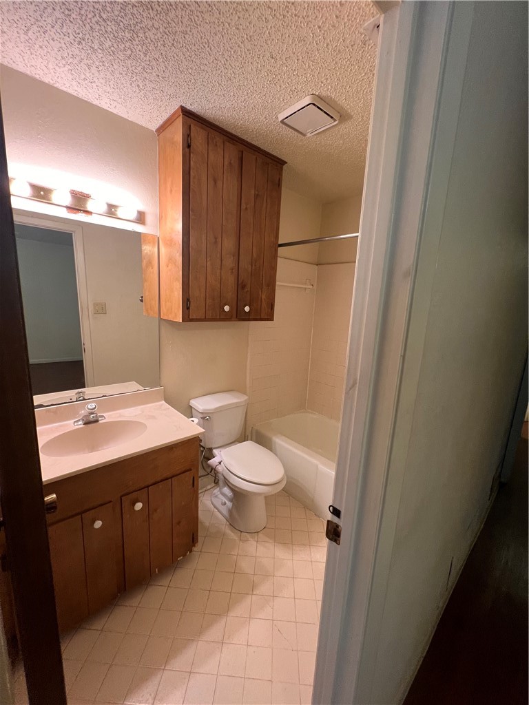 4021 Acushnet Drive, Unit F Corpus Christi, TX 78413 - Photo 14 of 21 a bathroom with a sink toilet and shower