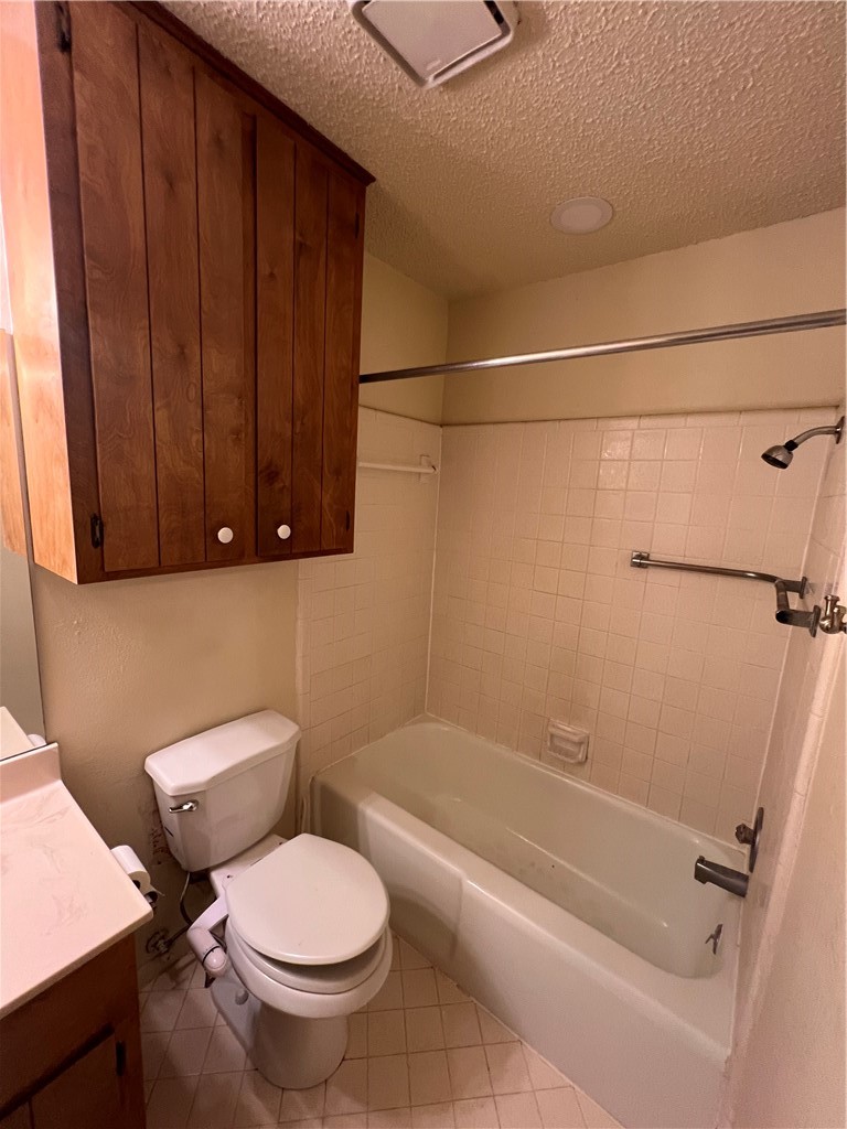 4021 Acushnet Drive, Unit F Corpus Christi, TX 78413 - Photo 15 of 21 a white toilet sitting next to a bath tub