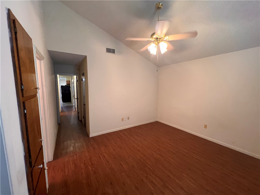 4021 Acushnet Drive, Unit F Corpus Christi, TX 78413 - Photo 18 of 21 wooden floor in an empty room with a mirror