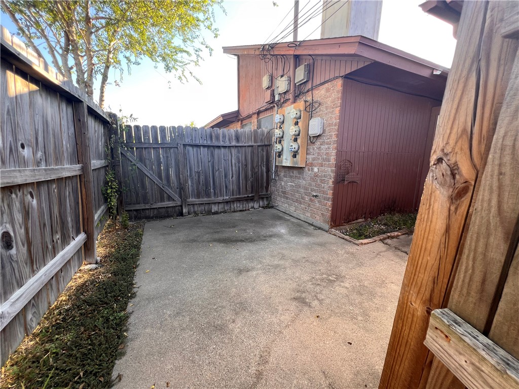 4021 Acushnet Drive, Unit F Corpus Christi, TX 78413 - Photo 21 of 21 a view of a backyard with a fence