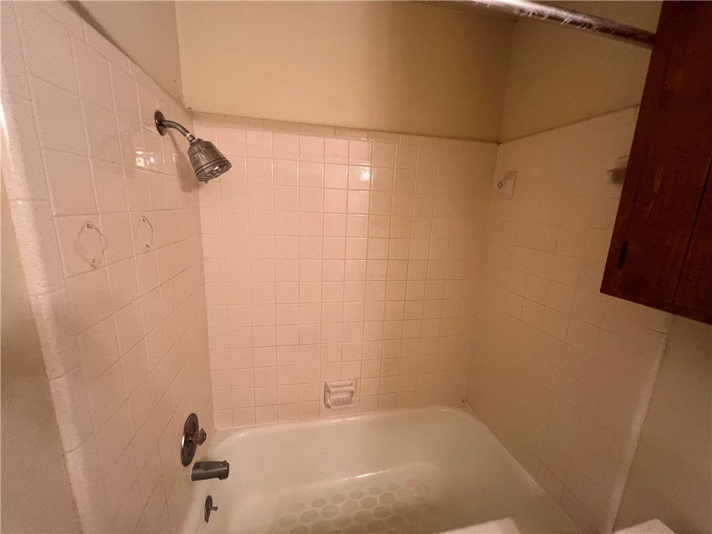 4021 Acushnet Drive, Unit F Corpus Christi, TX 78413 - Photo 10 of 21 a bathroom with a bathtub