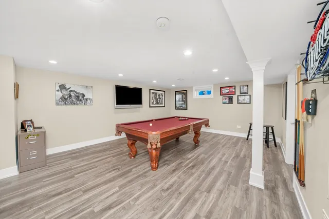 a room with wooden floor and furniture