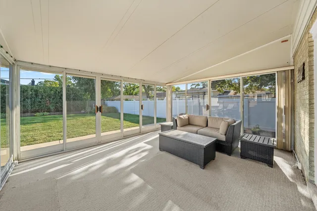 a living room with couch and a large window
