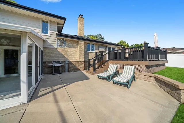 a view of a swimming pool with a lounge chair