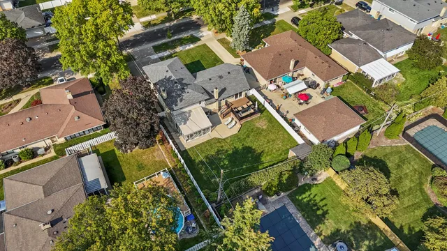 an aerial view of residential house with outdoor space and street view