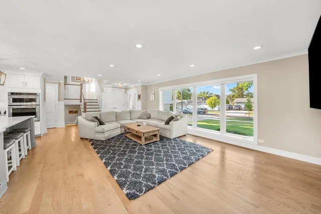 a living room with furniture rug and wooden floor