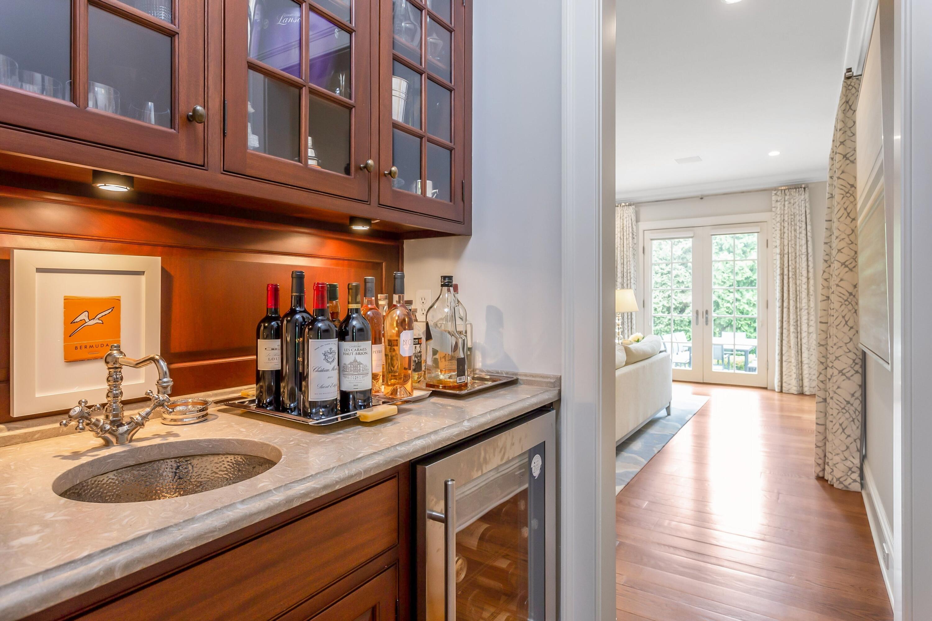 2 Harbor Bluff Lane Rowayton, CT 06853 - Photo 11 of 37 a view of a kitchen with granite countertop a sink and a wooden floor