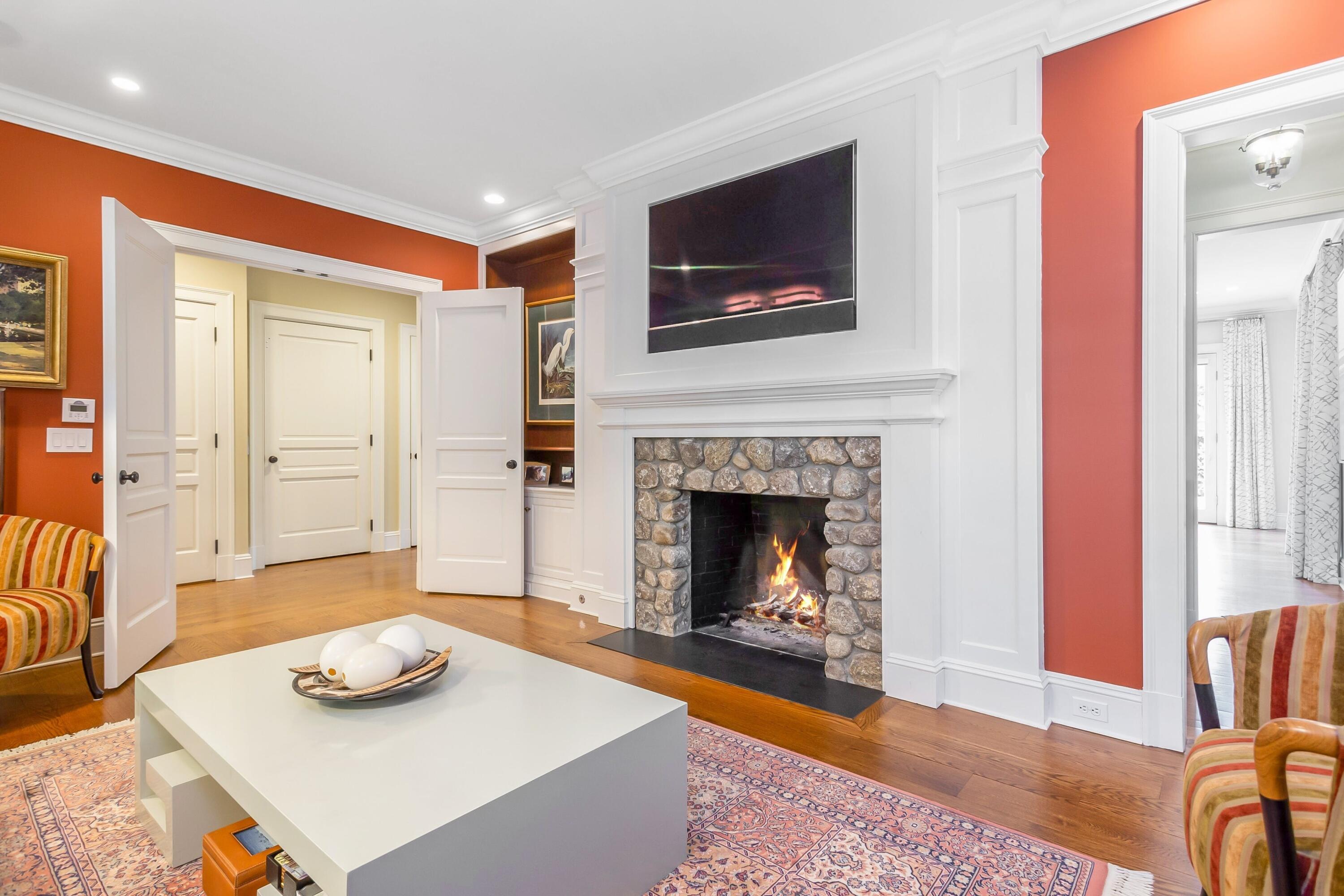 2 Harbor Bluff Lane Rowayton, CT 06853 - Photo 12 of 37 a living room with furniture and a fireplace
