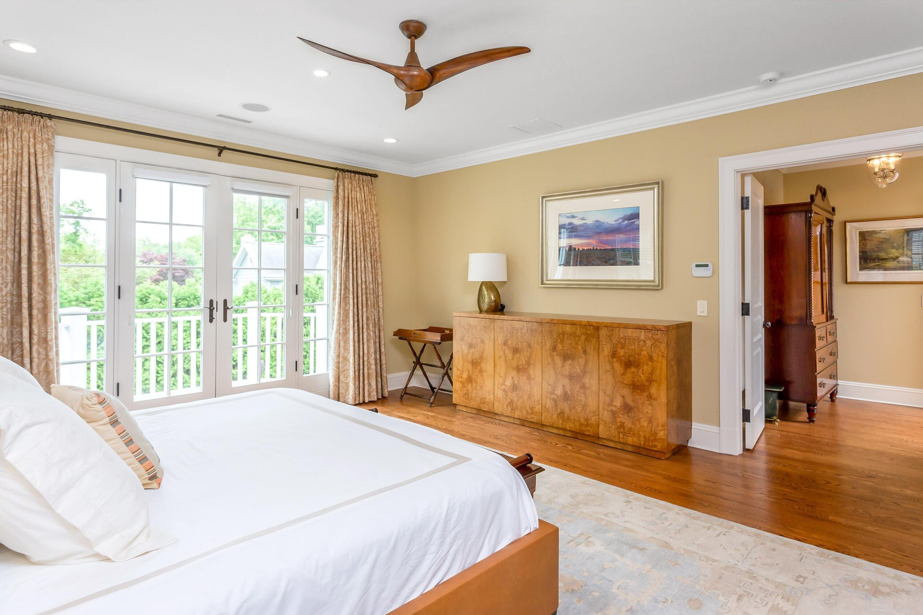 2 Harbor Bluff Lane Rowayton, CT 06853 - Photo 20 of 37 a spacious bedroom with a large bed and a window