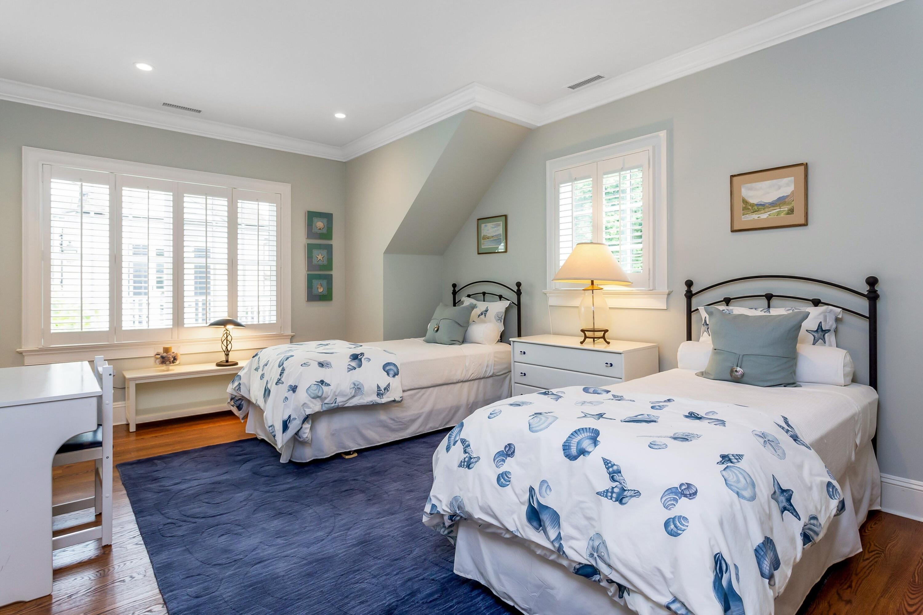 2 Harbor Bluff Lane Rowayton, CT 06853 - Photo 27 of 37 a bedroom with two beds and a large window