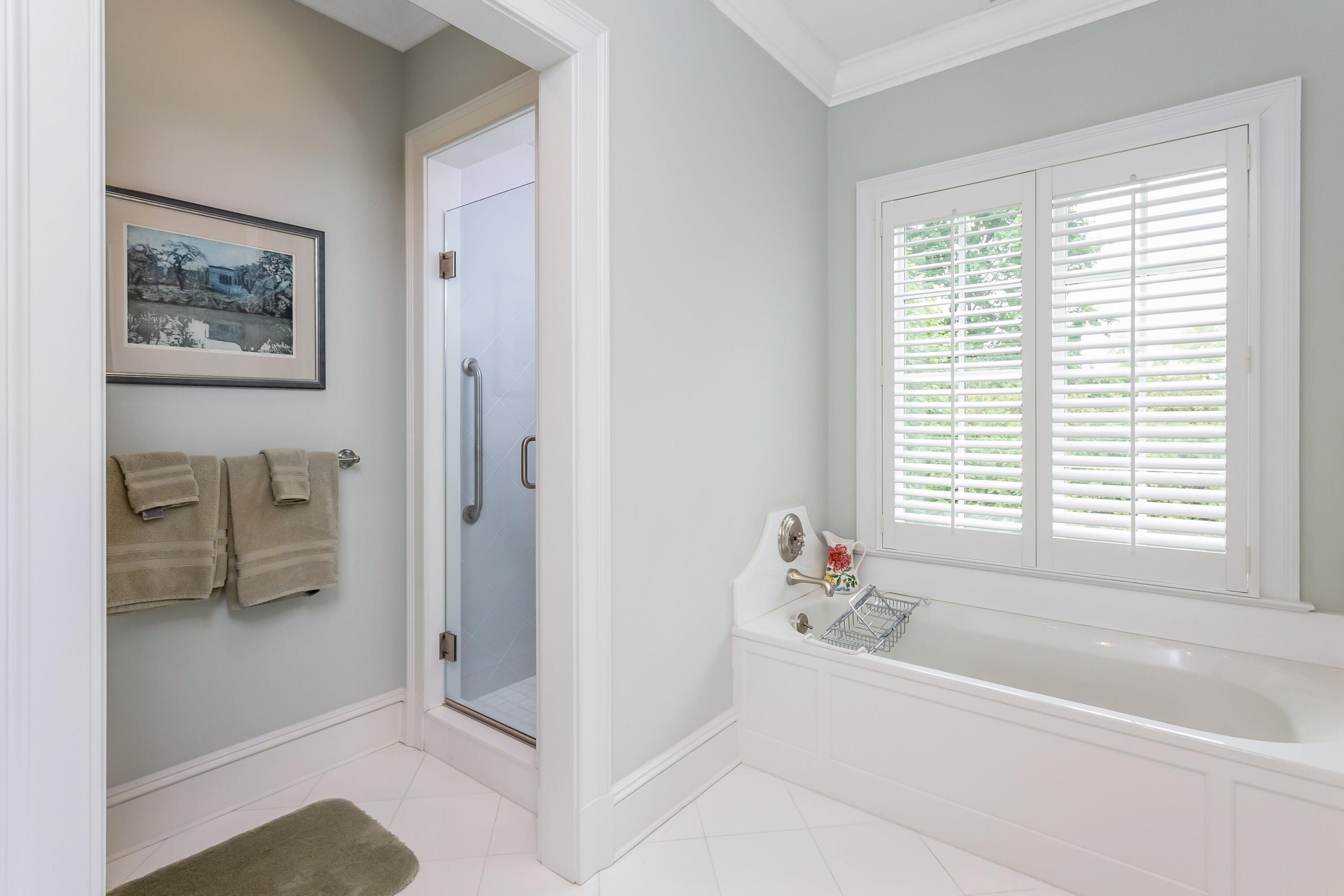 2 Harbor Bluff Lane Rowayton, CT 06853 - Photo 28 of 37 a white bath tub sitting next to a window