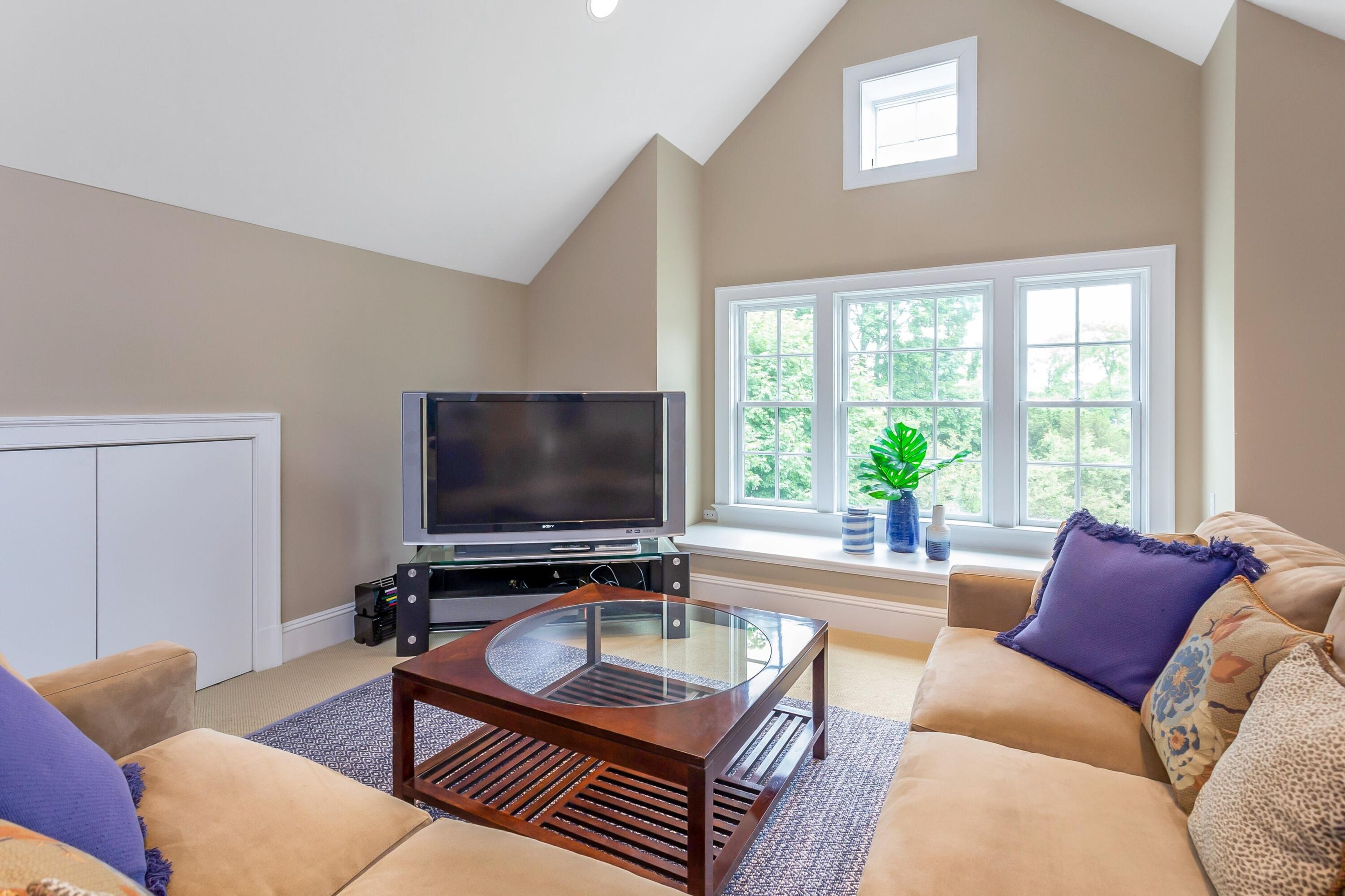 2 Harbor Bluff Lane Rowayton, CT 06853 - Photo 29 of 37 a living room with furniture and a flat screen tv