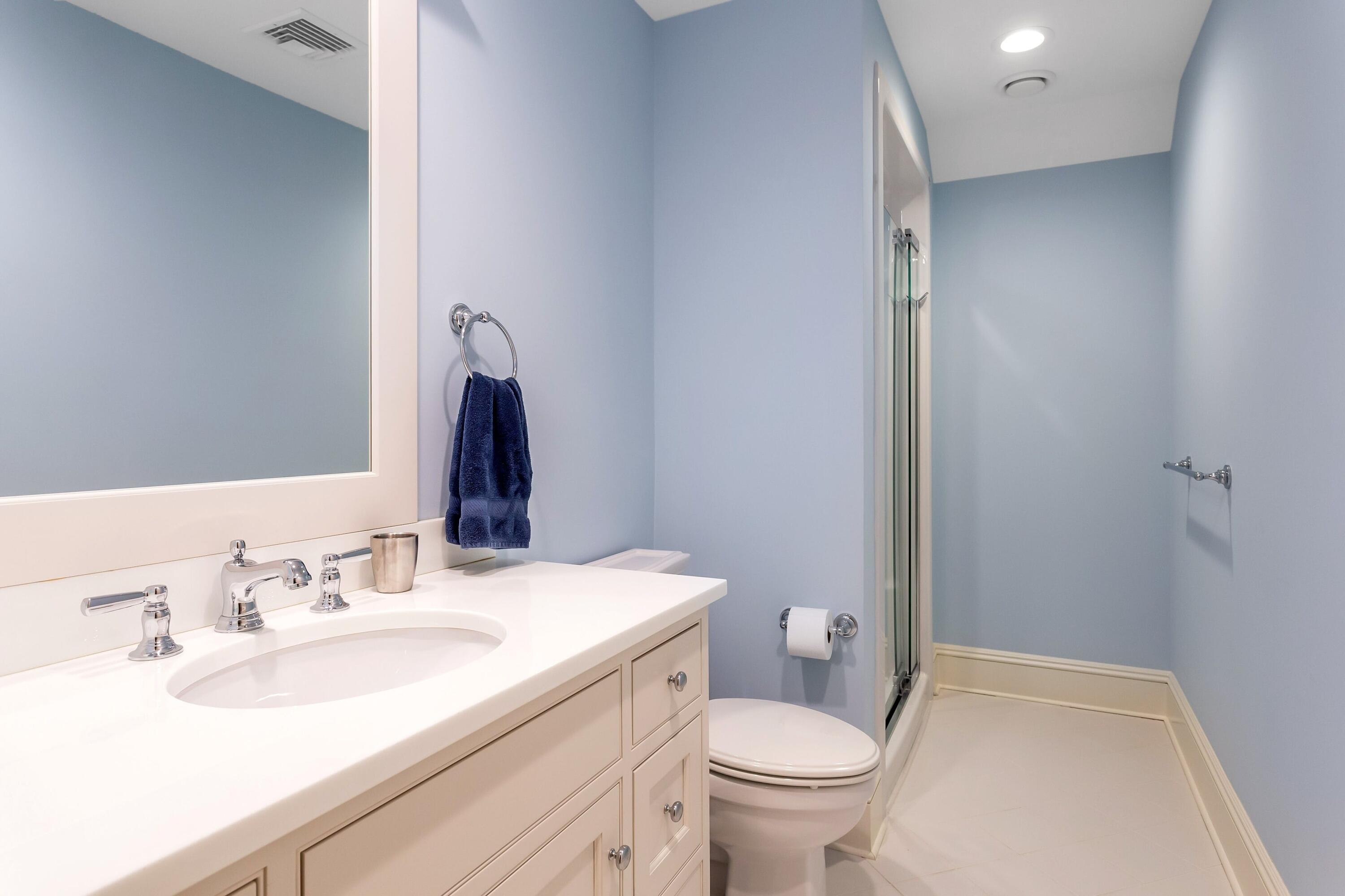 2 Harbor Bluff Lane Rowayton, CT 06853 - Photo 30 of 37 a bathroom with a sink and a mirror