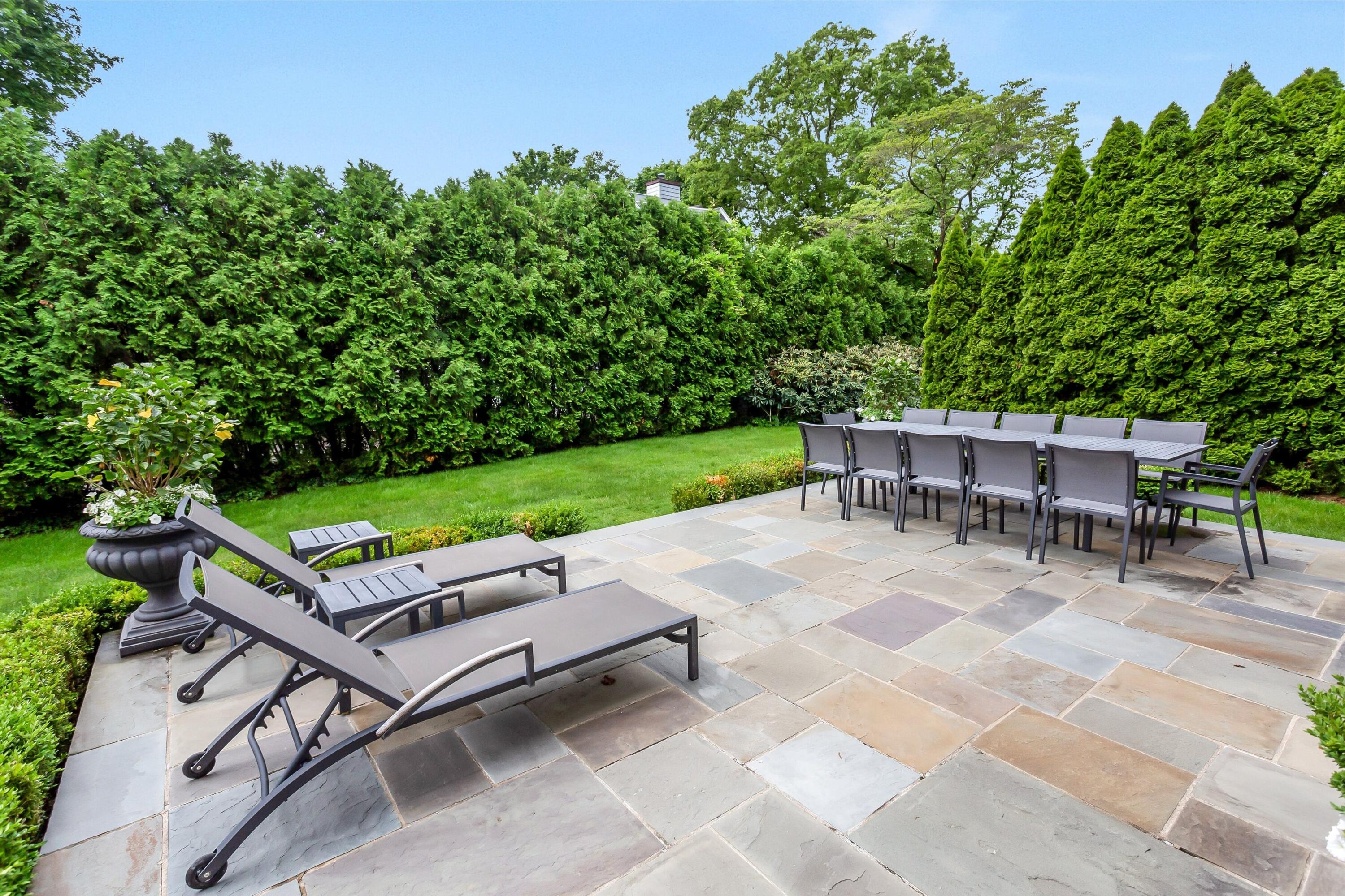 2 Harbor Bluff Lane Rowayton, CT 06853 - Photo 33 of 37 a view of a sitting area in a backyard