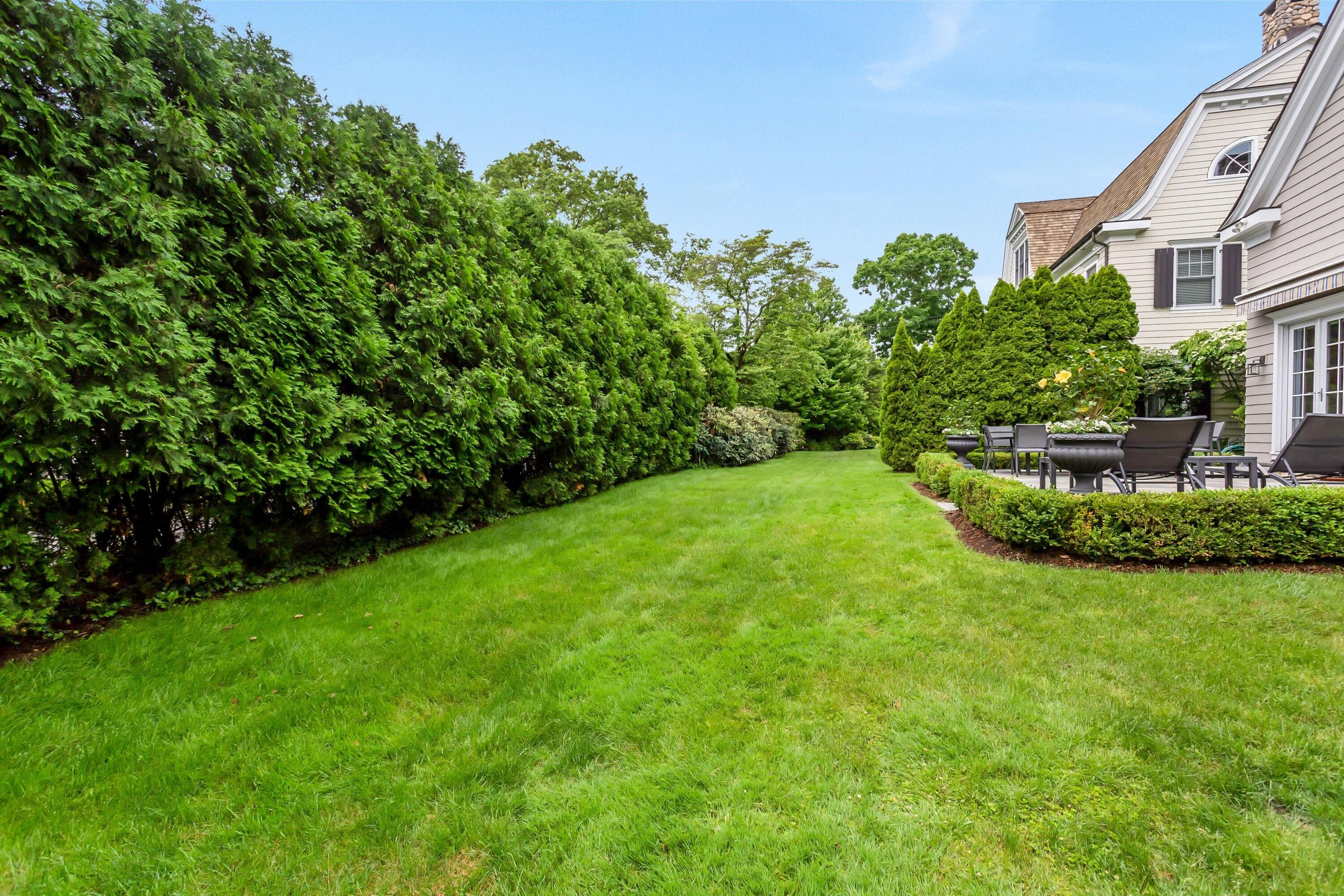 2 Harbor Bluff Lane Rowayton, CT 06853 - Photo 36 of 37 a view of a house with a big yard plants and large trees