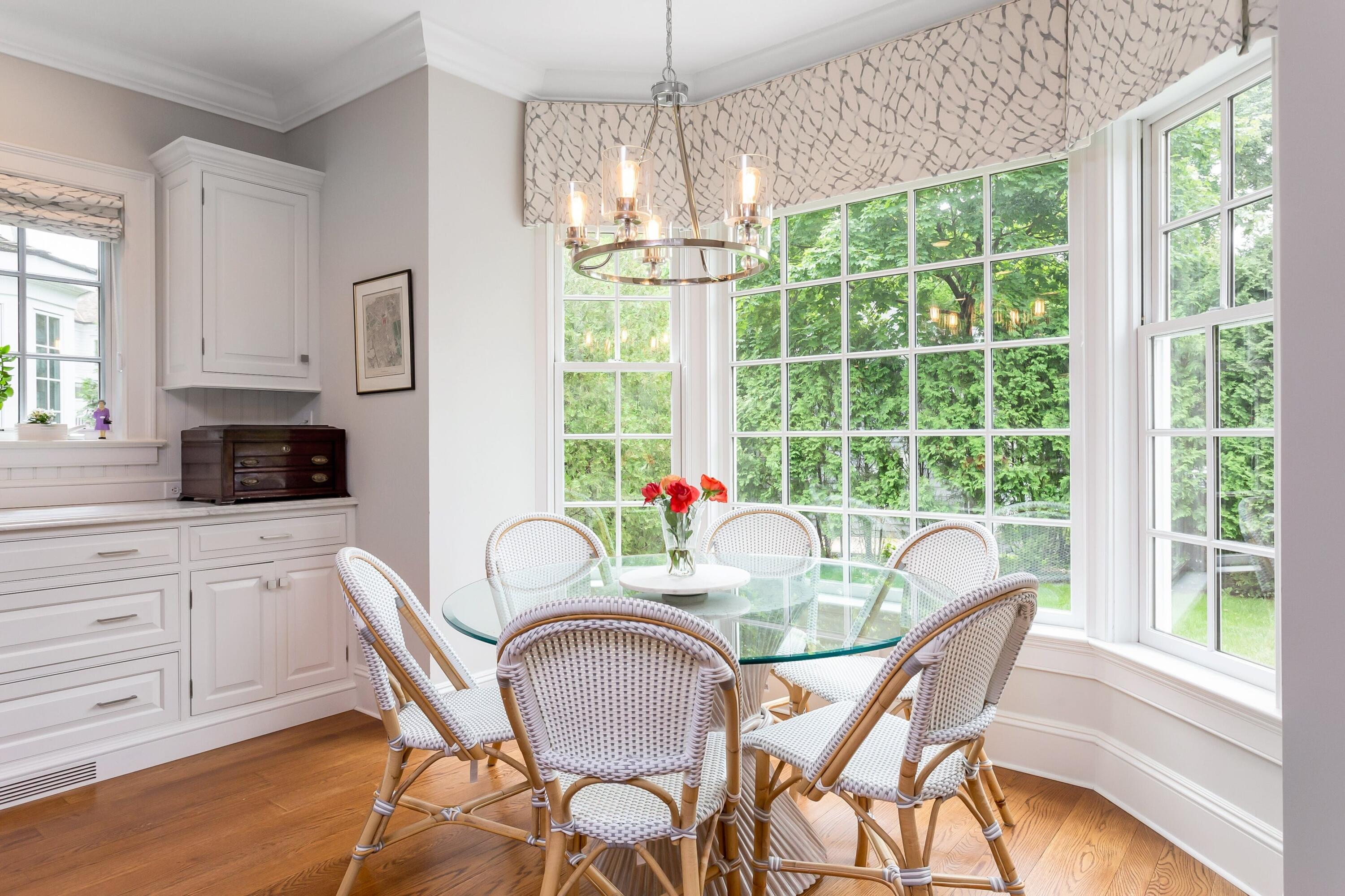 2 Harbor Bluff Lane Rowayton, CT 06853 - Photo 10 of 37 a dining room with furniture a chandelier and wooden floor