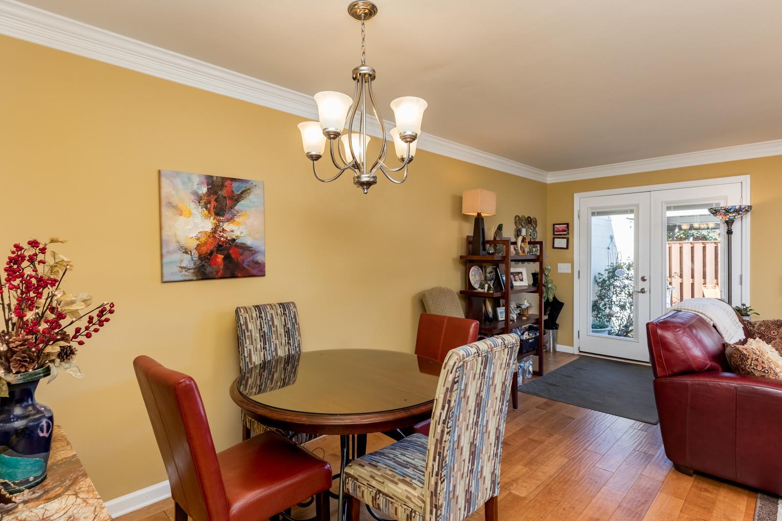 1306 General George Patton Road, Unit 1306 Nashville, TN 37221 - Photo 11 of 21 a view of a dining room with furniture wooden floor and chandelier
