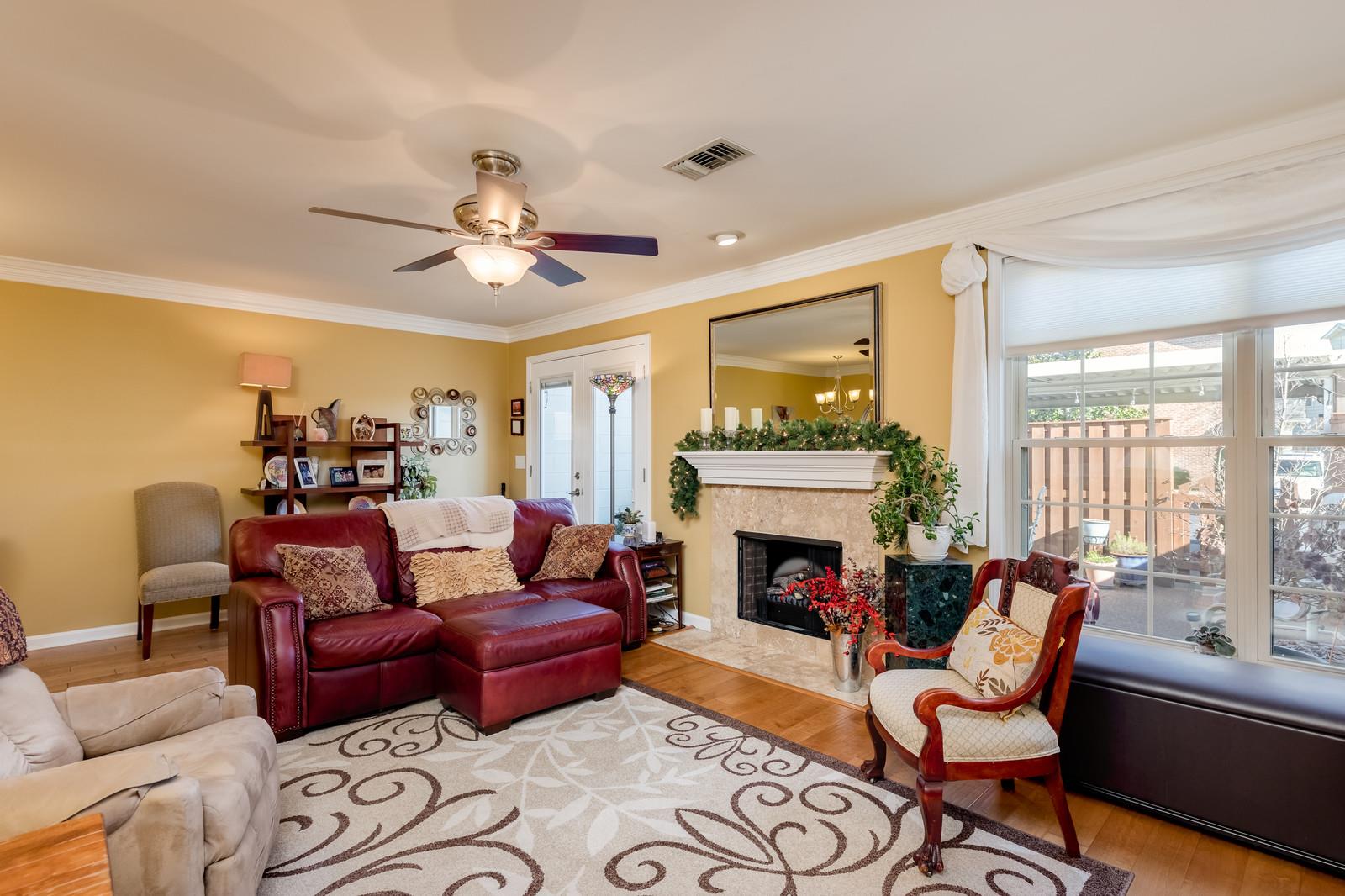 1306 General George Patton Road, Unit 1306 Nashville, TN 37221 - Photo 12 of 21 a living room with furniture fireplace and a large window