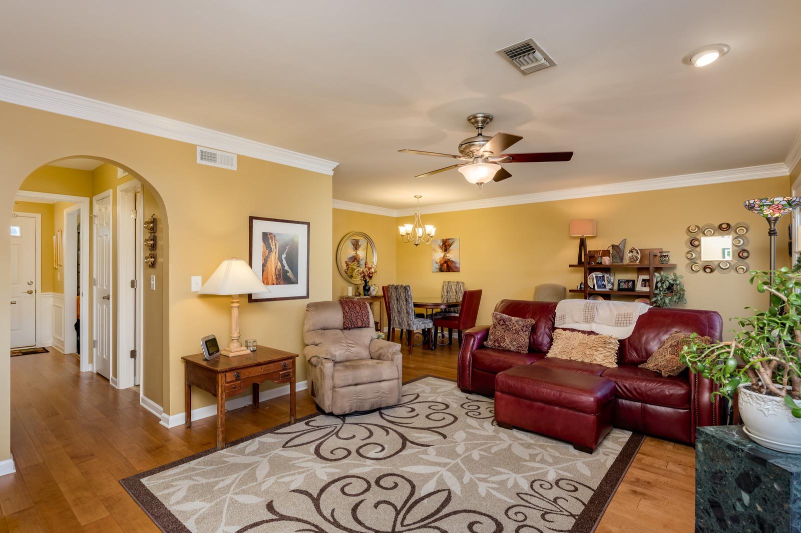 1306 General George Patton Road, Unit 1306 Nashville, TN 37221 - Photo 13 of 21 a living room with furniture ceiling fan and a rug