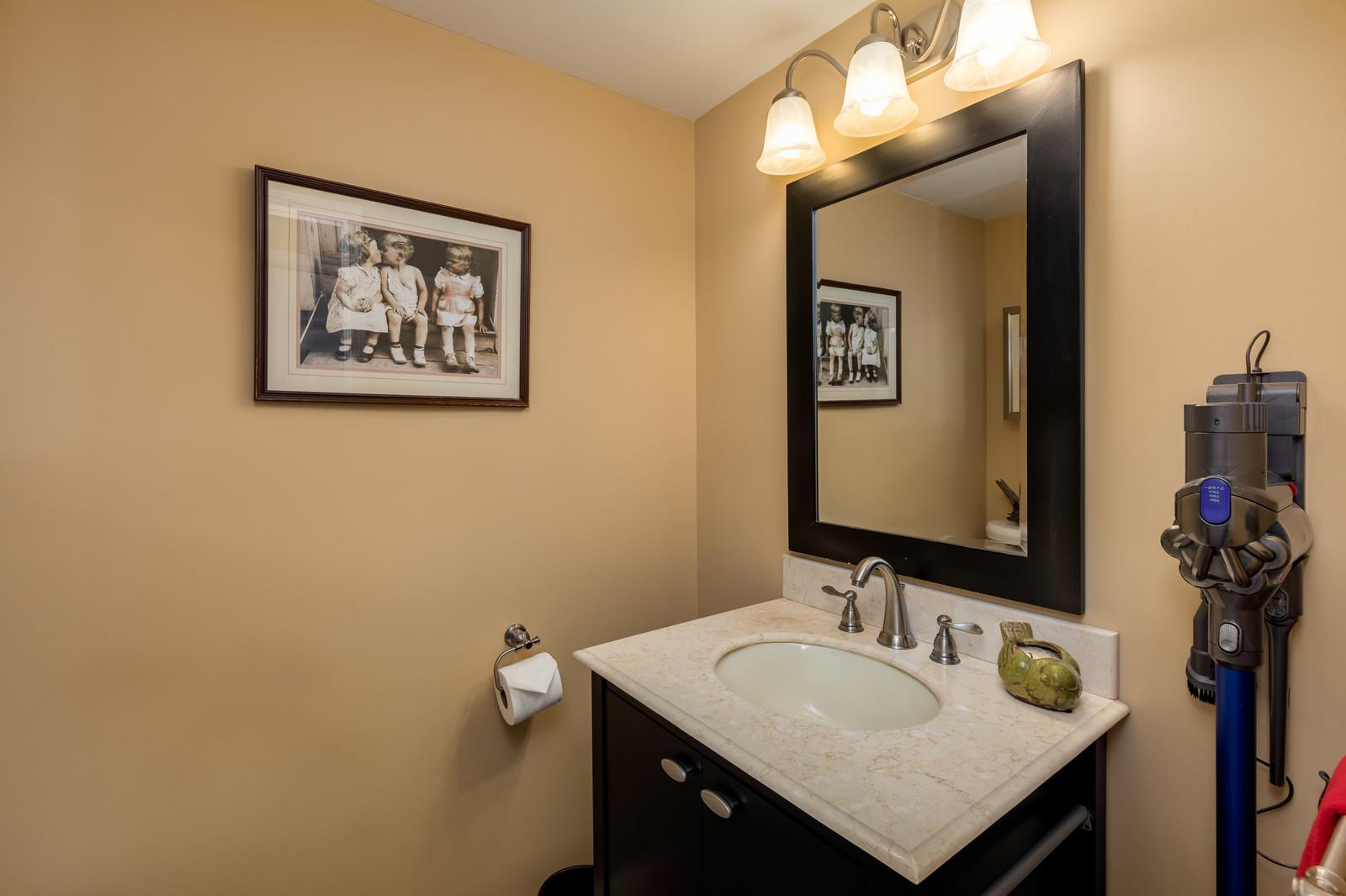 1306 General George Patton Road, Unit 1306 Nashville, TN 37221 - Photo 14 of 21 a bathroom with a sink vanity and a mirror