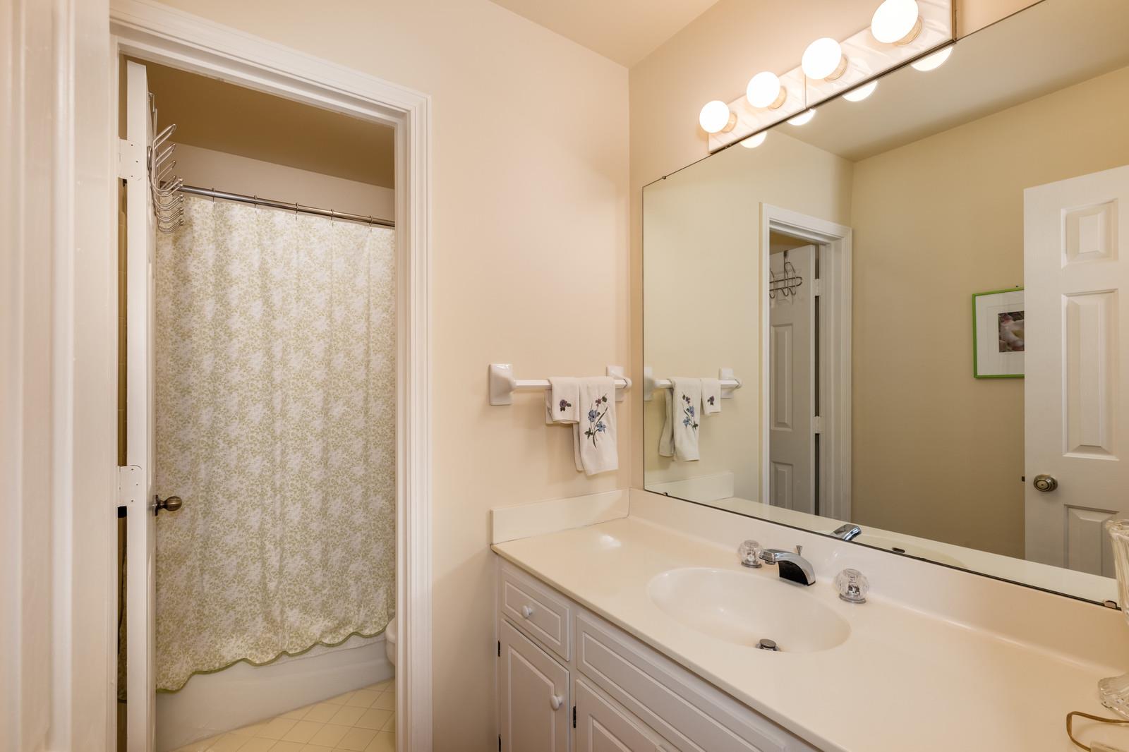 1306 General George Patton Road, Unit 1306 Nashville, TN 37221 - Photo 18 of 21 a bathroom with a sink and a mirror