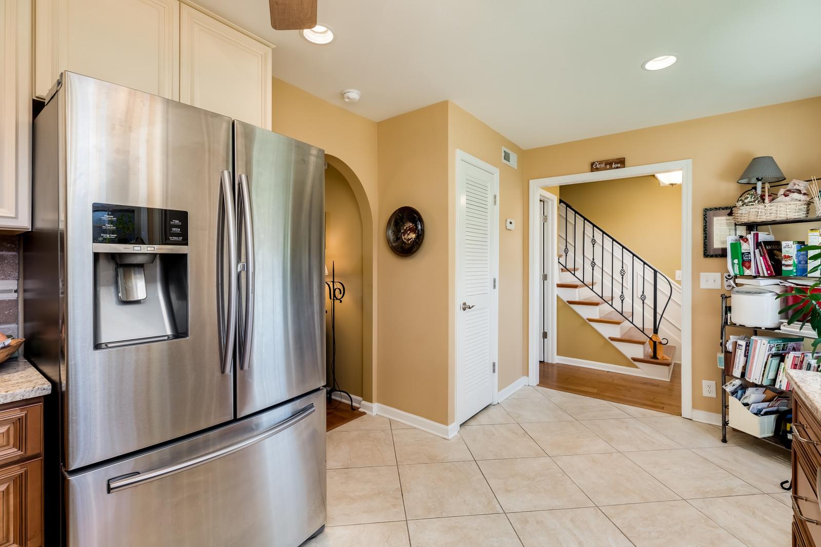 1306 General George Patton Road, Unit 1306 Nashville, TN 37221 - Photo 6 of 21 a kitchen with stainless steel appliances a refrigerator and a stove top oven
