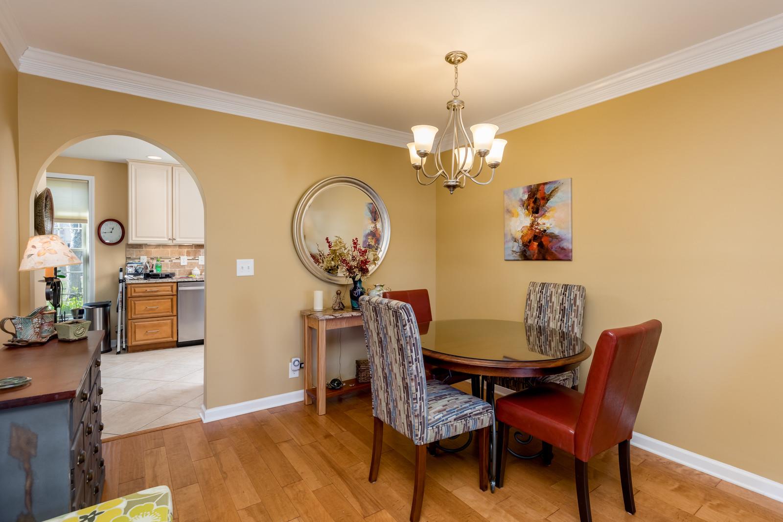 1306 General George Patton Road, Unit 1306 Nashville, TN 37221 - Photo 10 of 21 a view of a dining room with furniture and chandelier