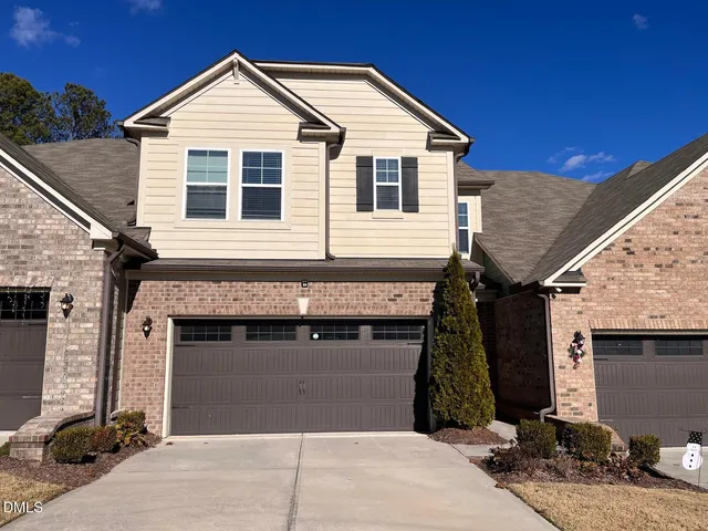 a front view of a house with yard
