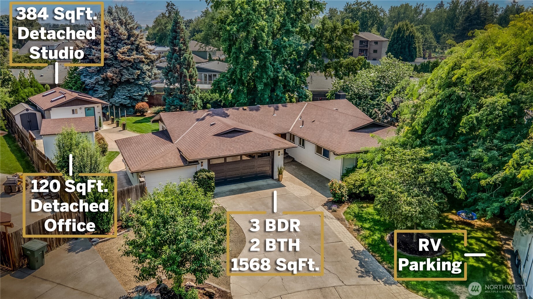 an aerial view of a residential apartment building with a yard
