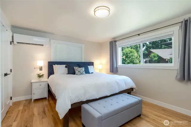 a bedroom with a bed and window