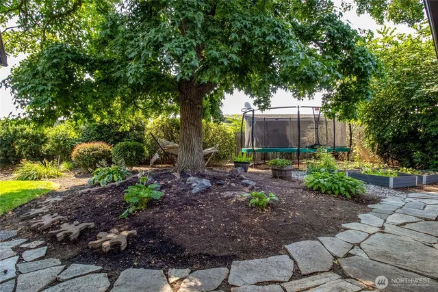 a front view of a house with a yard table and chairs