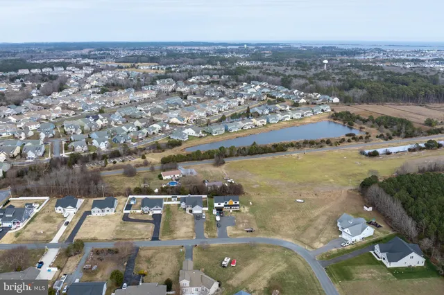 an aerial view of a residential houses with outdoor space