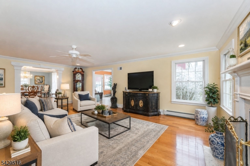 107 Clove Road, Unit 3 Wantage, NJ 07461 - Photo 11 of 45 a living room with furniture a flat screen tv and a fireplace