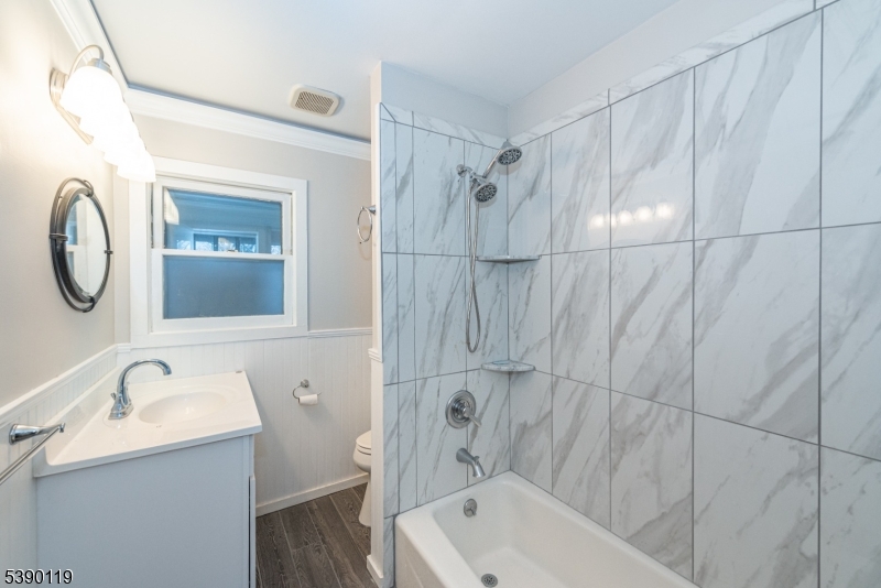 107 Clove Road, Unit 3 Wantage, NJ 07461 - Photo 34 of 45 a bathroom with a sink a toilet and a bathtub