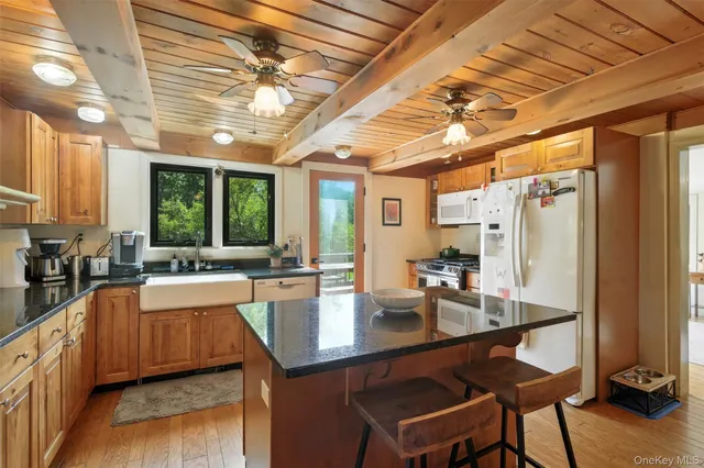 a kitchen with lots of counter top space and wooden floor