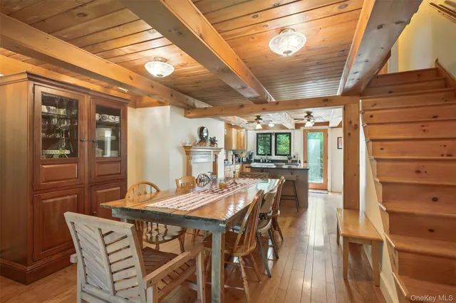 a view of a dining room with furniture and window